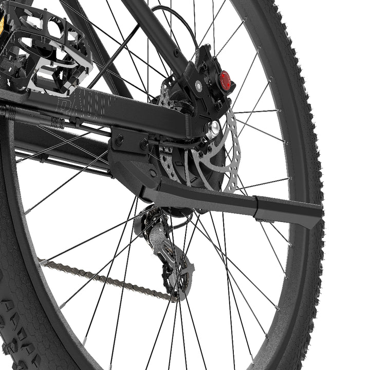 Close-up of a bicycle wheel with chain and gear mechanism on a white background