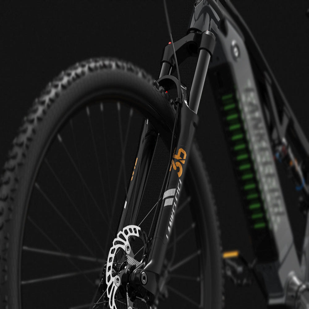 Close-up of a bicycle's front wheel and suspension fork on a dark background