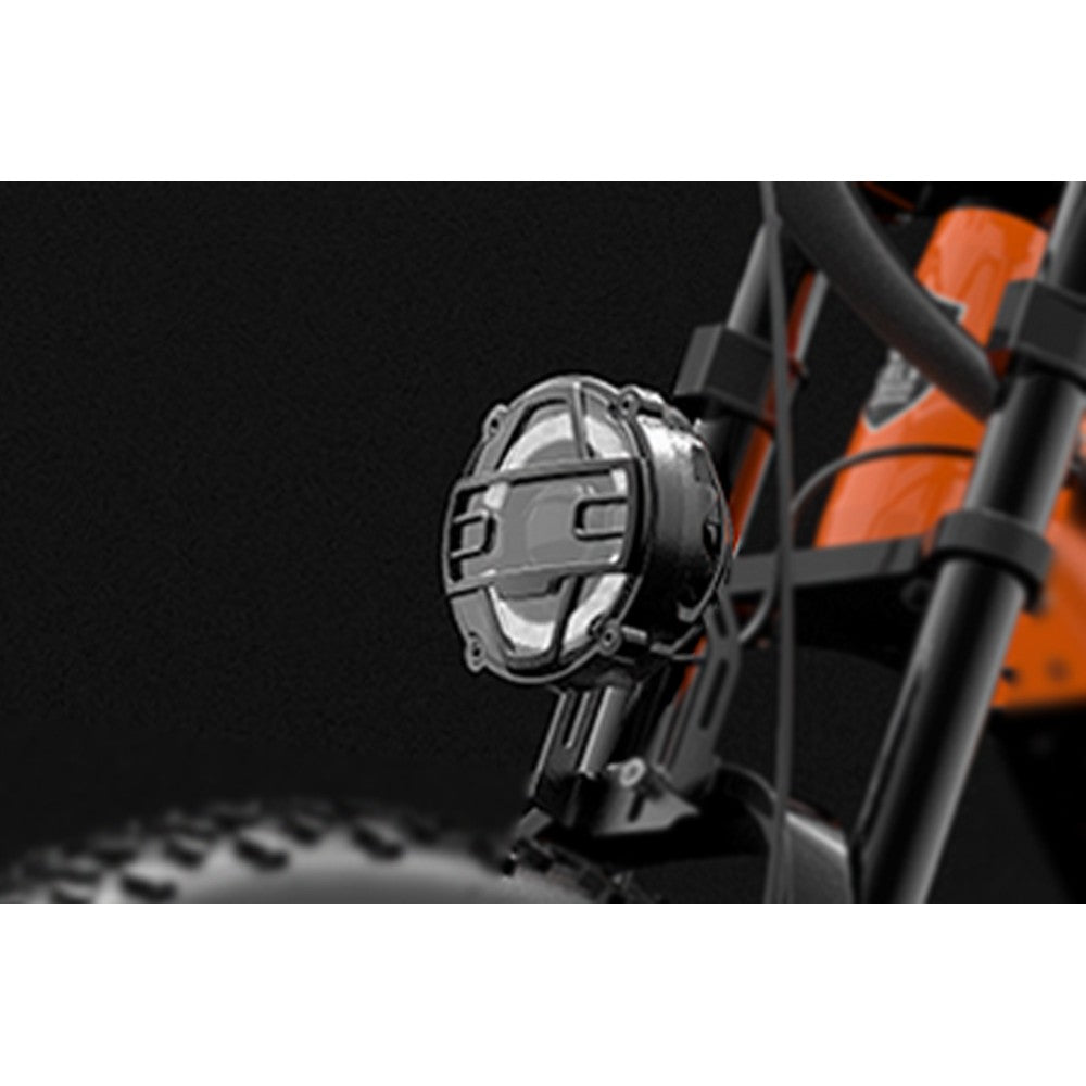 Close-up of a motorcycle light with a brand logo on a black background