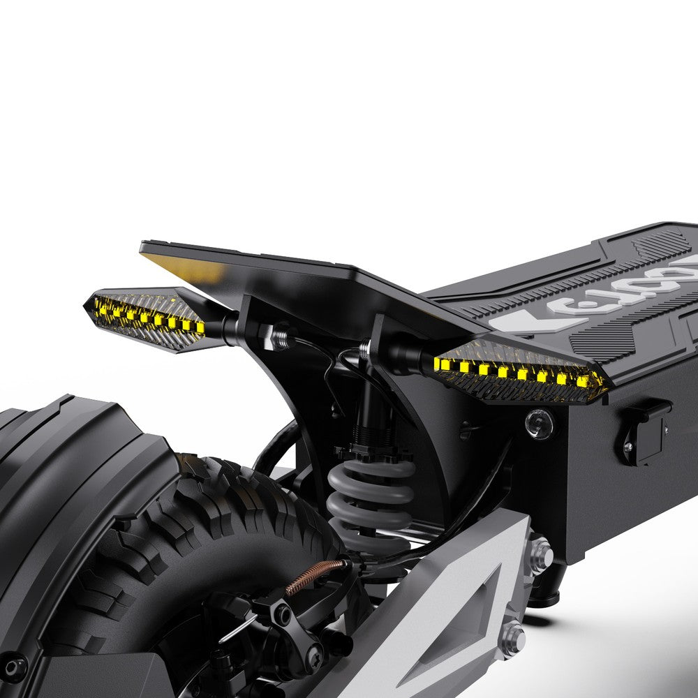 Close-up of a motorcycle's suspension and LED lights on a white background