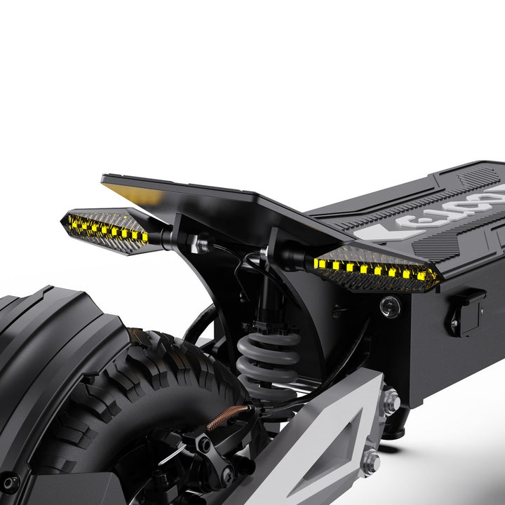 Close-up of a motorcycle's suspension and LED lights on a white background