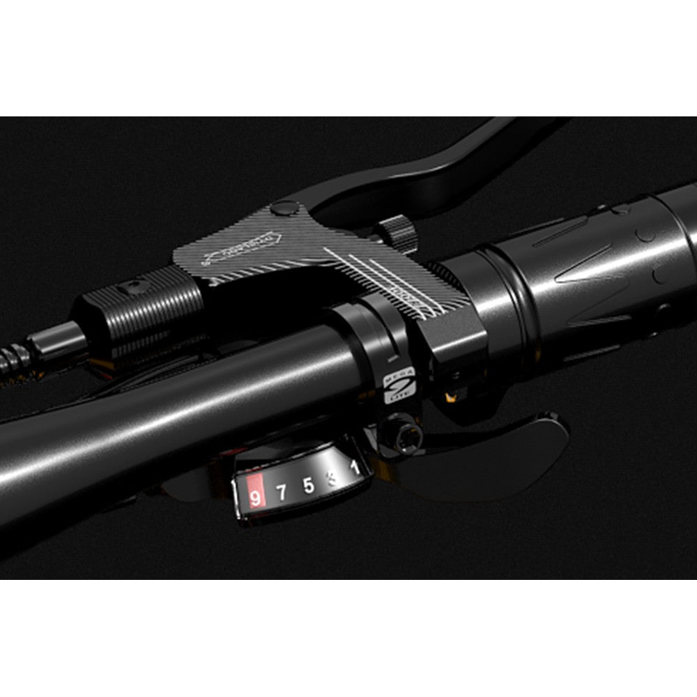 Close-up of a motorcycle handlebar with control switch on a dark background