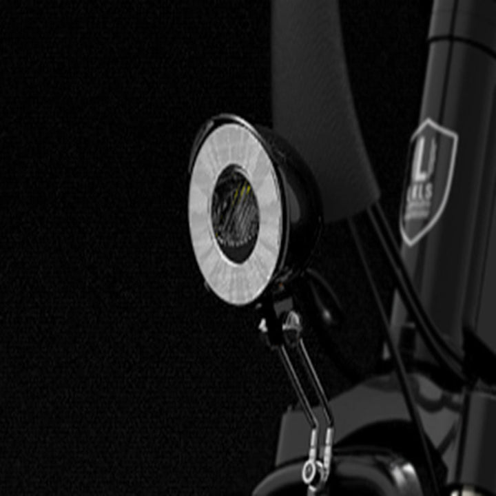 Close-up of a motorcycle mirror with a brand logo on a black background