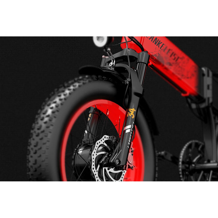 Close-up of a bicycle wheel with red rim and black tire on a dark background