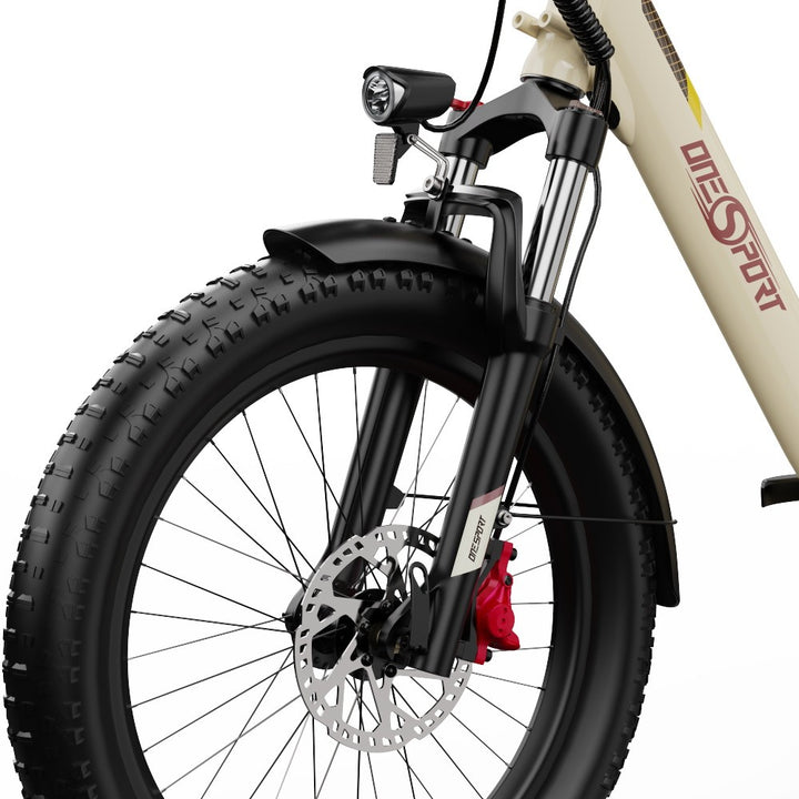Close-up of a bicycle wheel with disc brake and red component on a white background