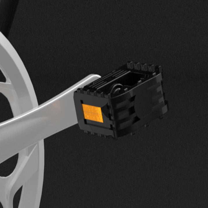 Bicycle pedal with a black plastic cover on a dark background