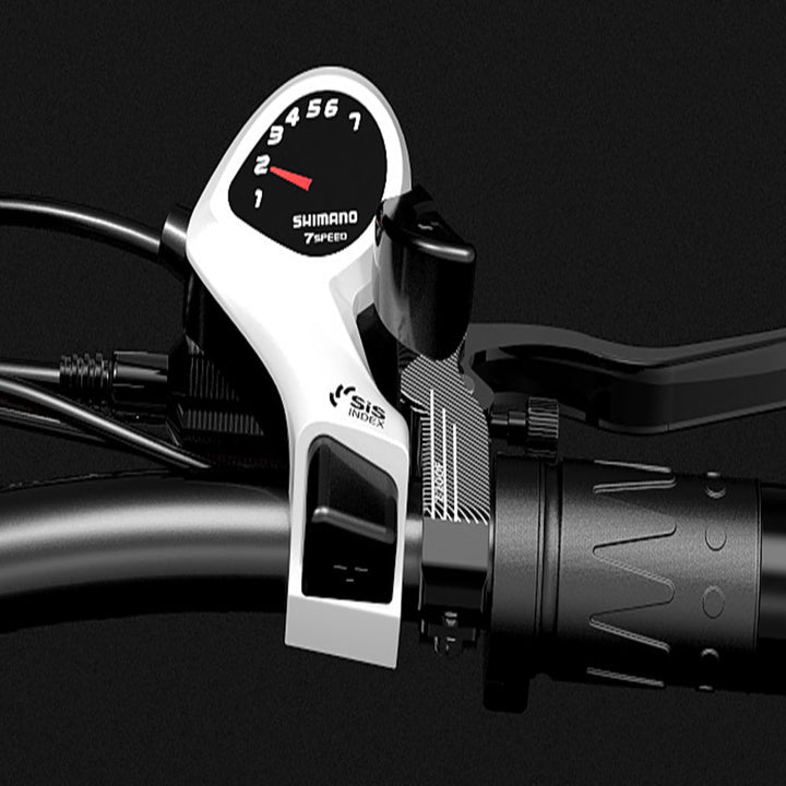 Close-up of a Shimano shift lever with a gauge on a dark background
