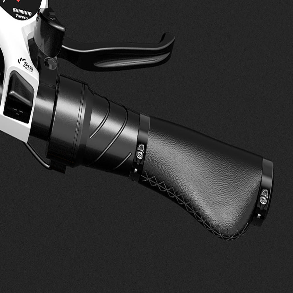 Close-up of a black motorcycle throttle grip with Shimano branding on a black background