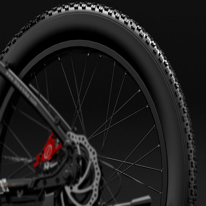 Close-up of a bicycle wheel with a dark background