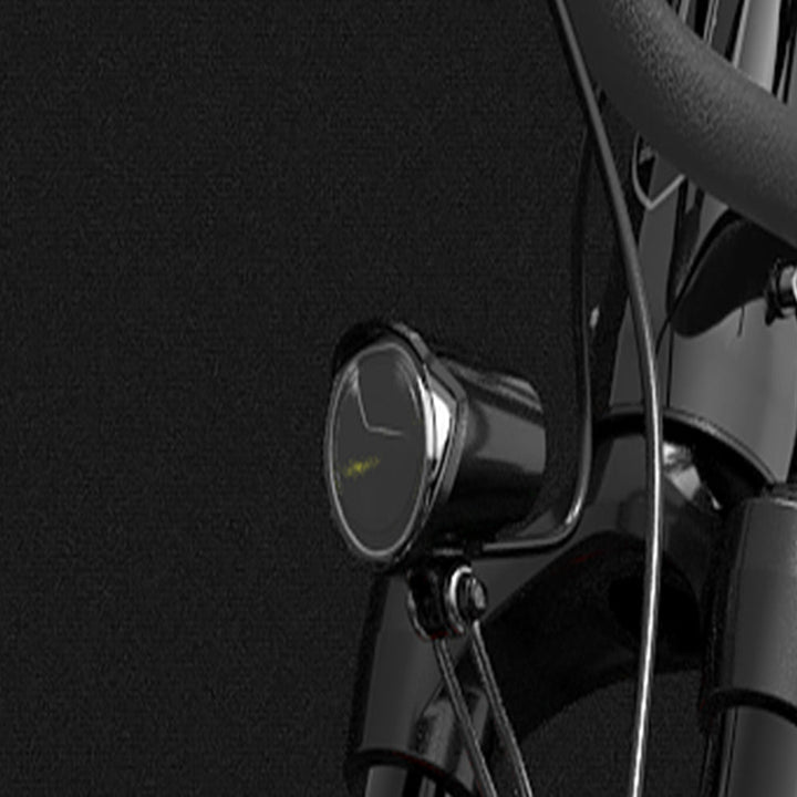 Close-up of a motorcycle handlebar with a dark background