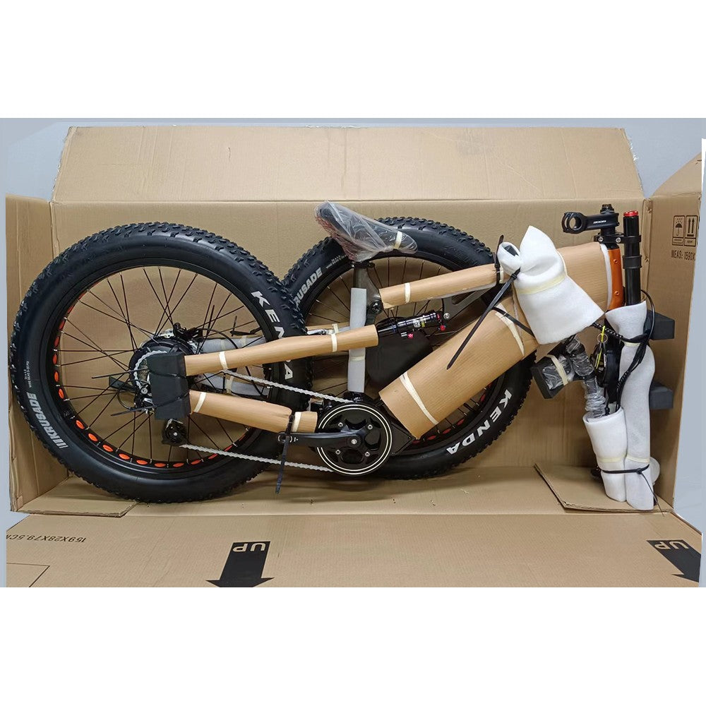 Folded bicycle inside a cardboard box on a light gray background
