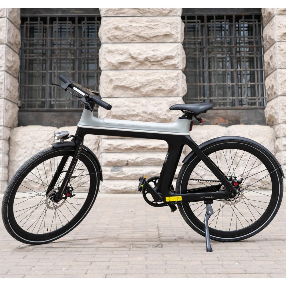 Modern bicycle parked against a stone wall