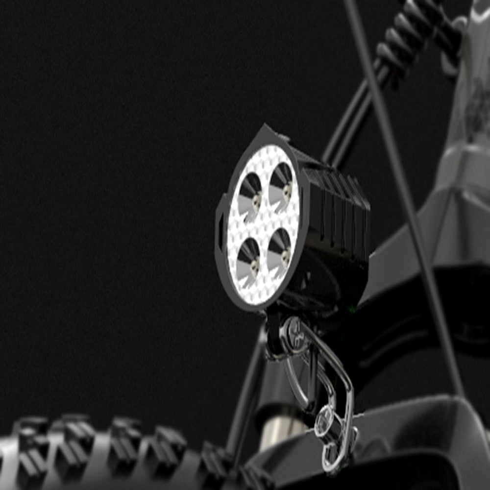LED work light attached to a vehicle's roof rack on a dark background