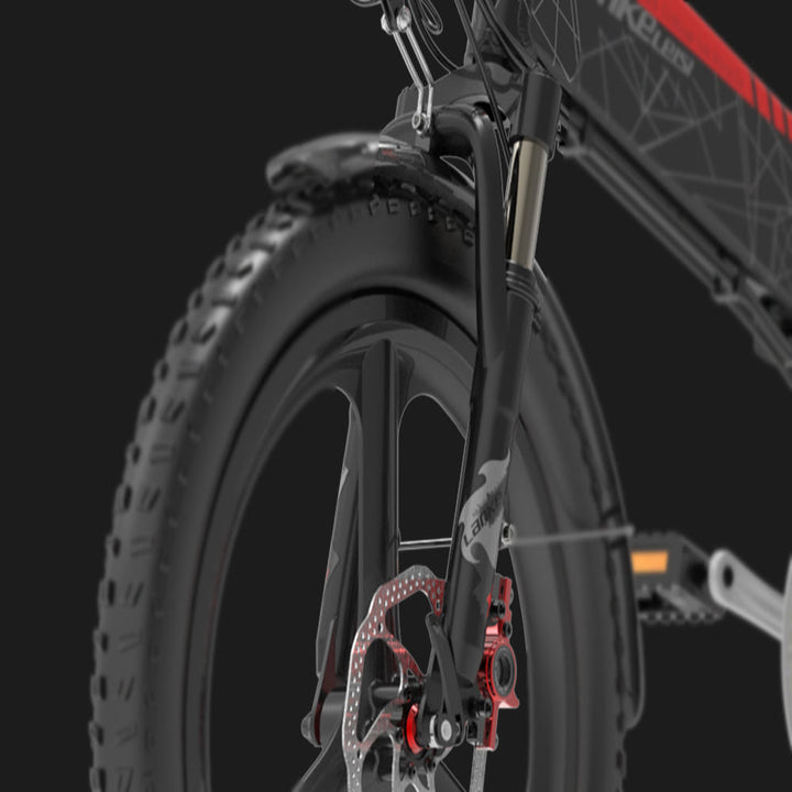 Close-up of a bicycle wheel with suspension fork on a black background