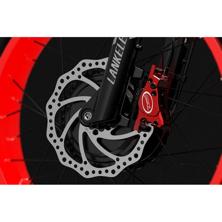 Close-up of a bicycle disc brake system with red and black components.
