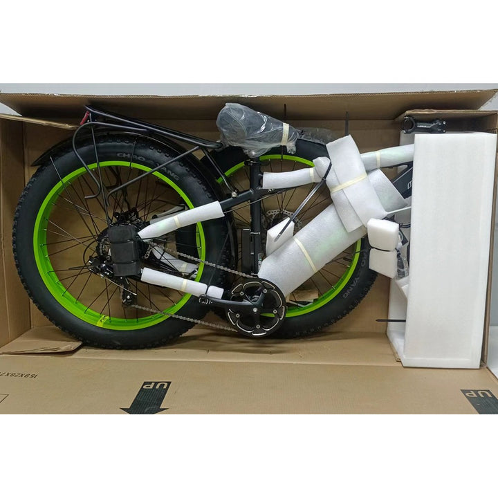 e-bike with green wheels inside a box