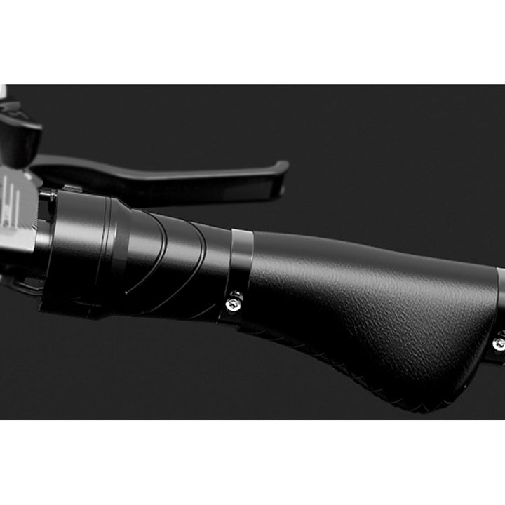 Close-up of a black rifle stock with a dark background