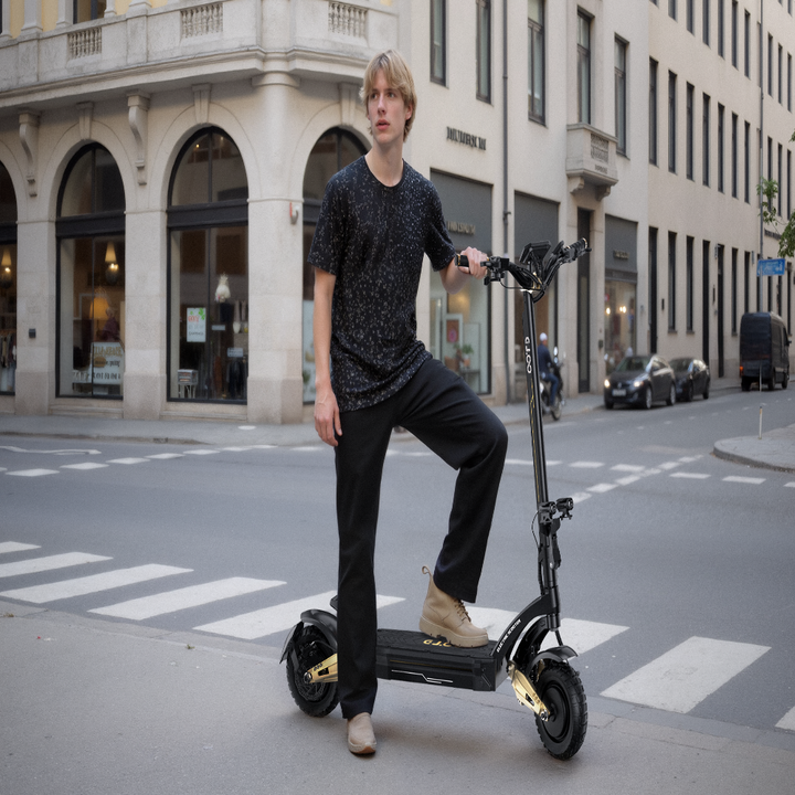 Person riding an electric scooter on a city street