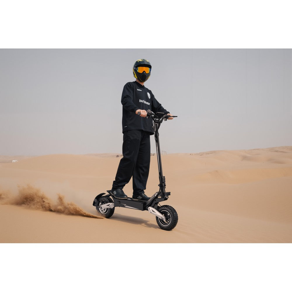 Person riding an electric scooter in a desert setting