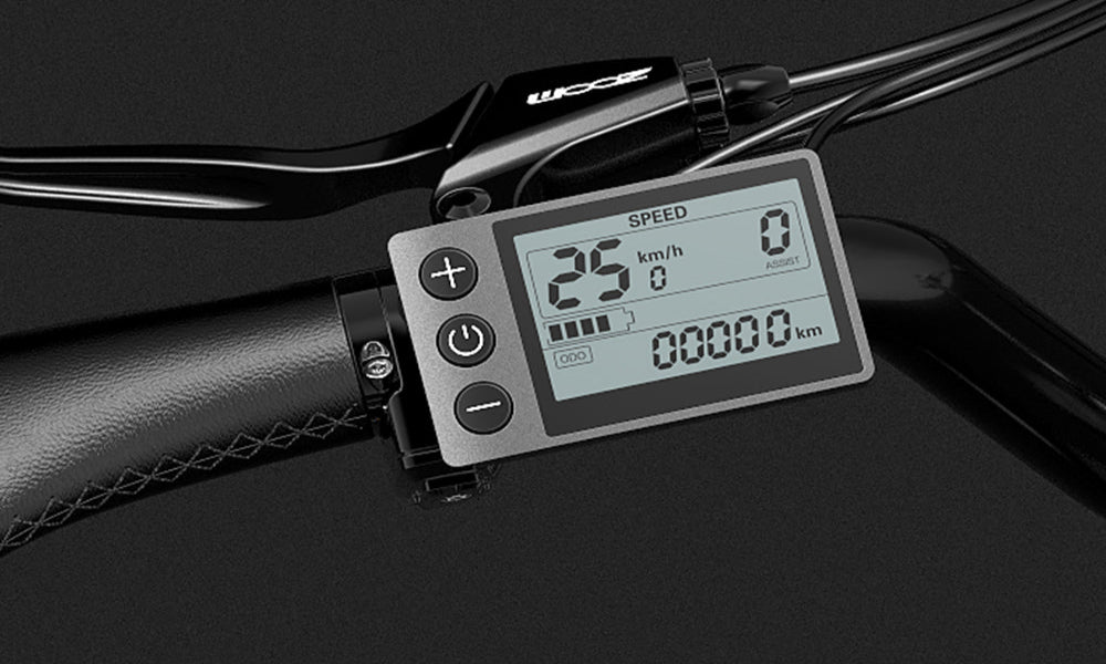 Digital speedometer attached to a bicycle handlebar with a black background