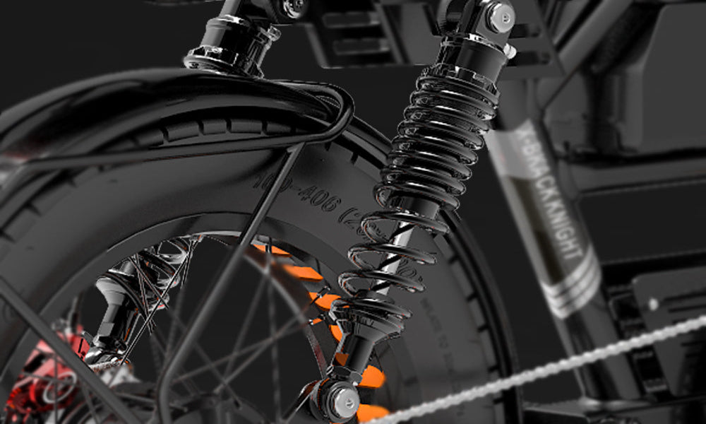Close-up of a motorcycle suspension system with 'Kenda' branding on a dark background