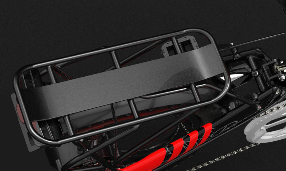 Close-up of a motorcycle's rear rack and chain on a black background