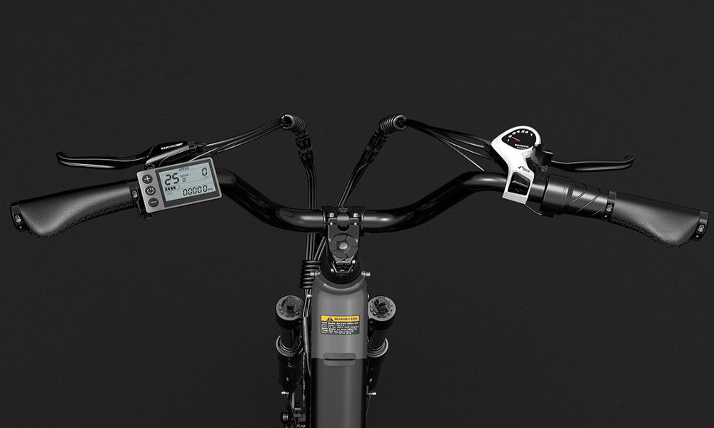Close-up of a bicycle handlebar with digital display on a black background