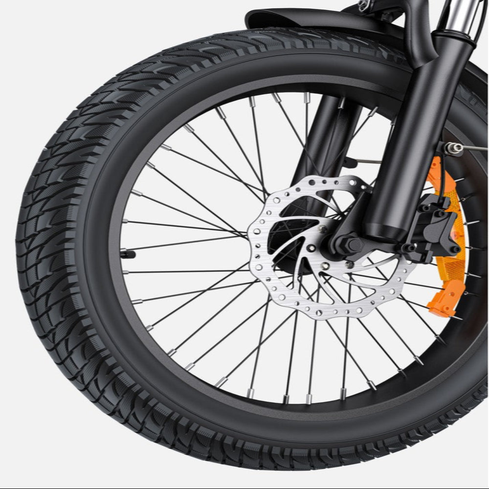 Close-up of a bicycle wheel with tire and suspension fork on a white background
