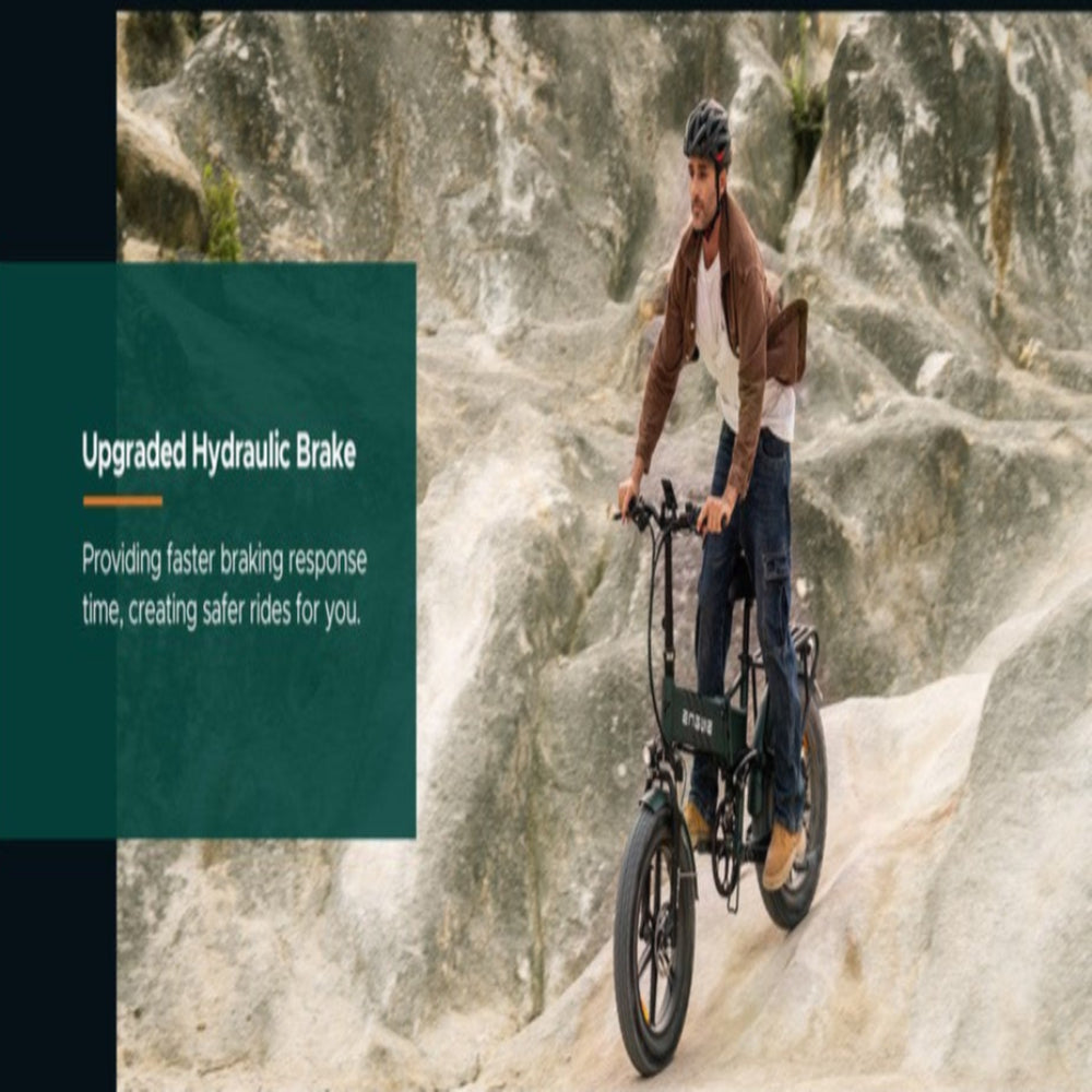 Person riding a bike with an upgraded hydraulic brake feature on a mountainous background.