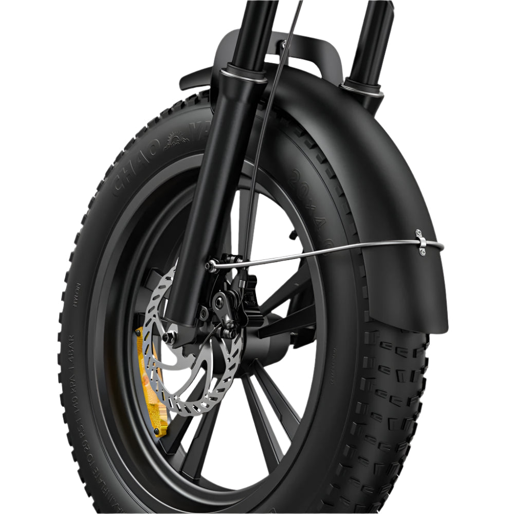 Close-up of a bicycle wheel with a black fender on a gray background