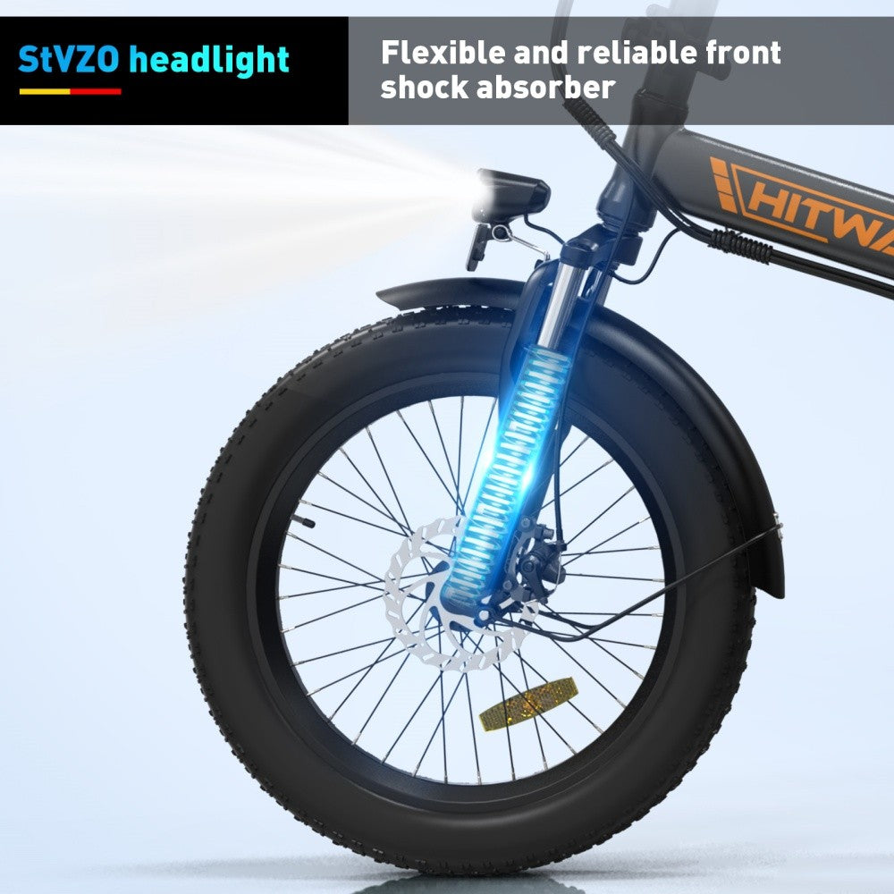 Bicycle wheel with blue shock absorber on a light gray background, featuring StVZO and HITWAY branding.
