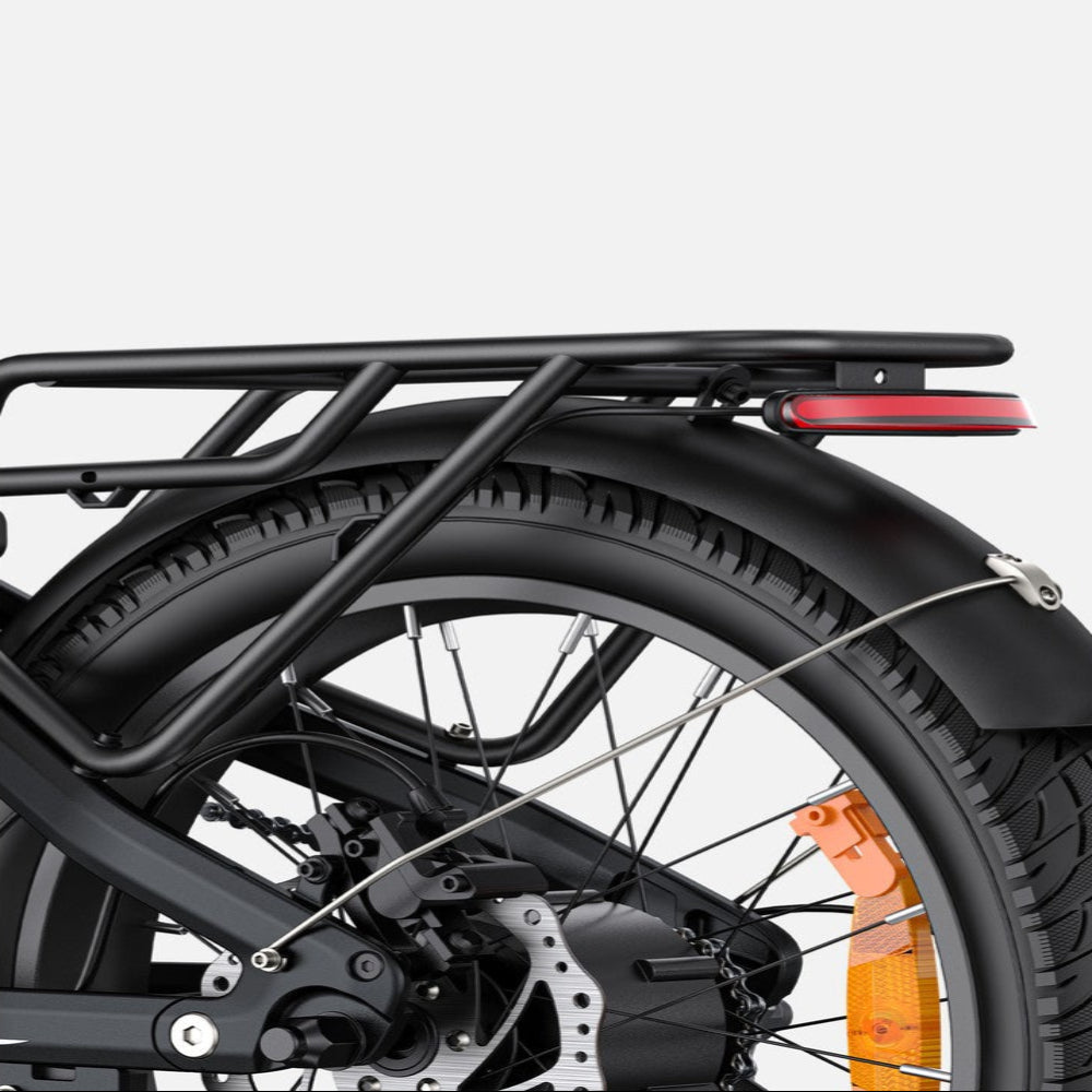 Close-up of a black electric bike with a red reflector on a white background