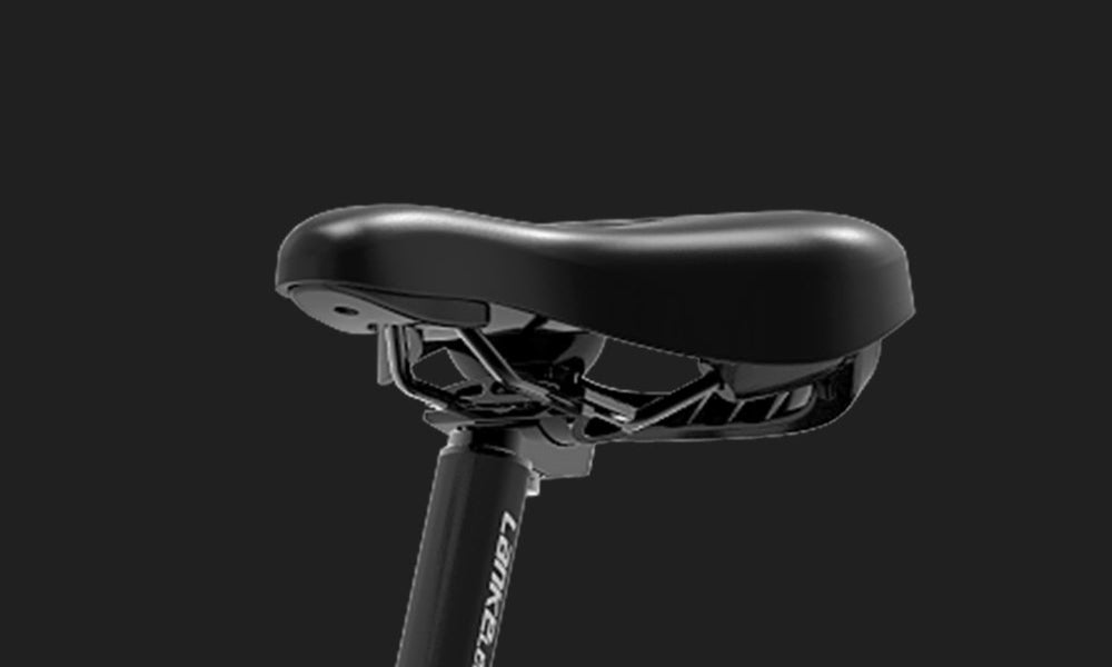 Close-up of a black bicycle seat with a blurred background