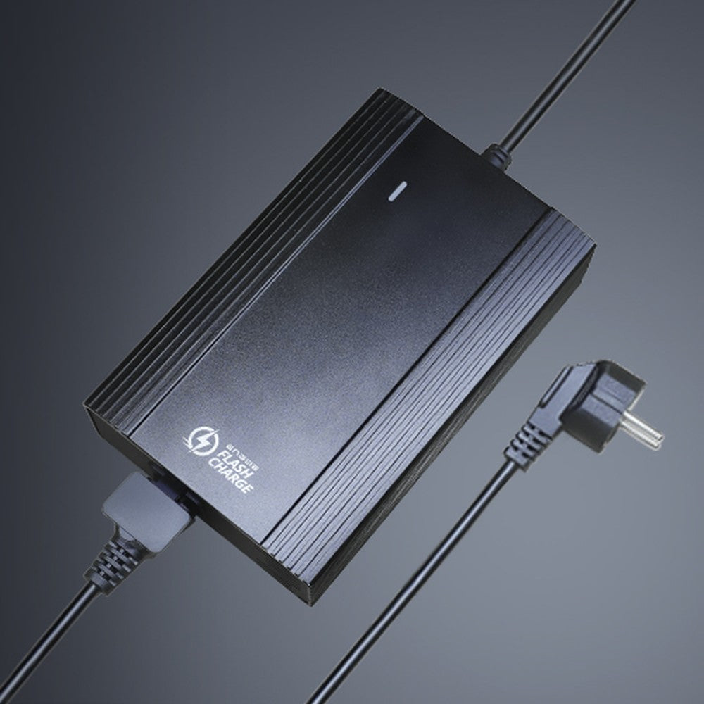 Black power adapter with cable on a dark background