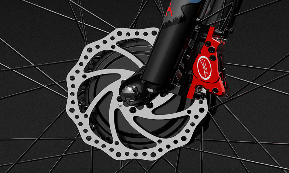 Close-up of a bicycle disc brake system with a red caliper on a black background