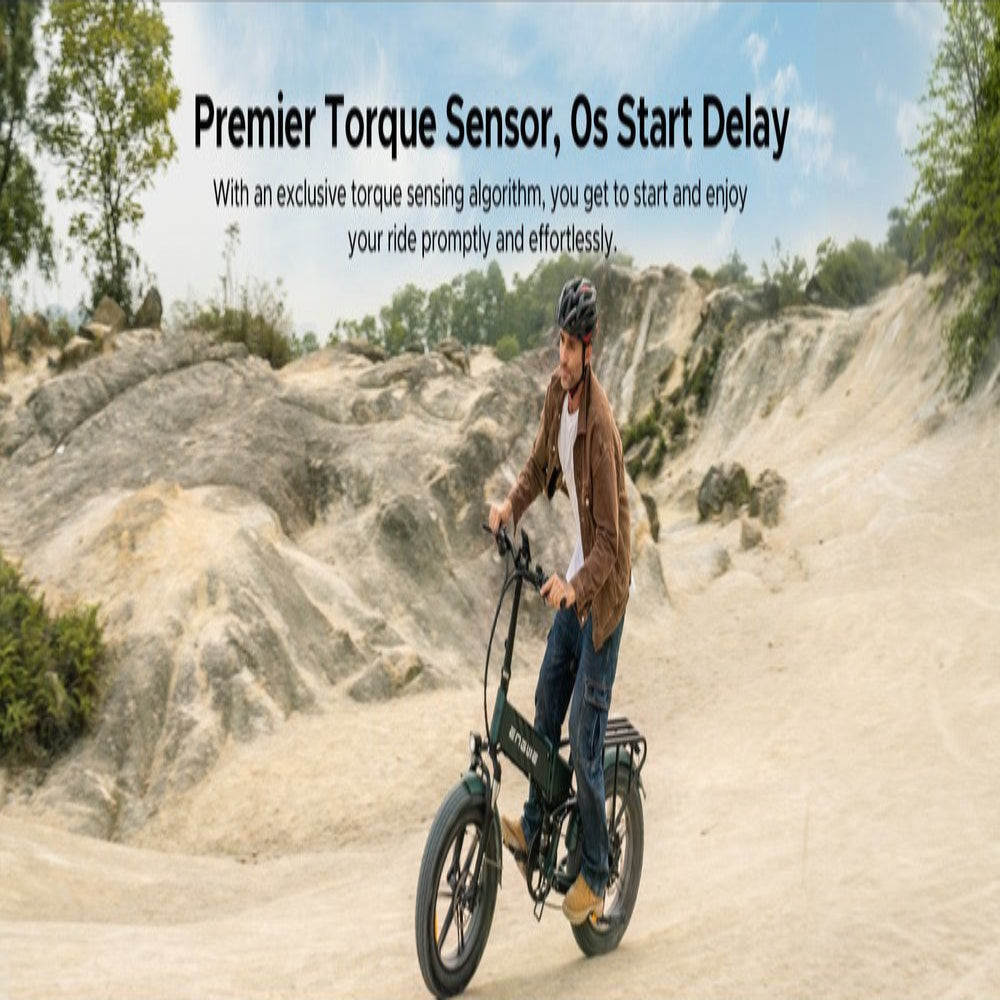 Person riding an electric bike on a dirt path with promotional text about torque sensor and start delay.
