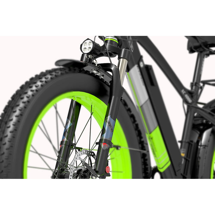 Close-up of a bicycle with green rim and black frame on a white background