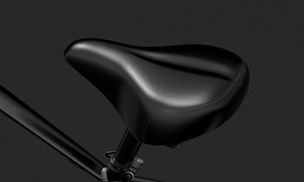 Black bicycle seat on a dark background