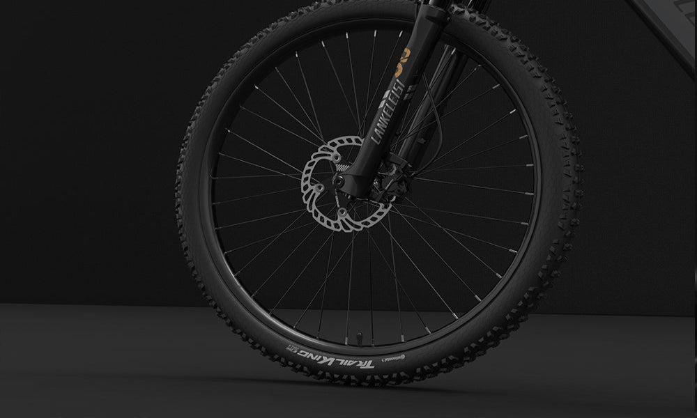 Close-up of a bicycle wheel with a dark background