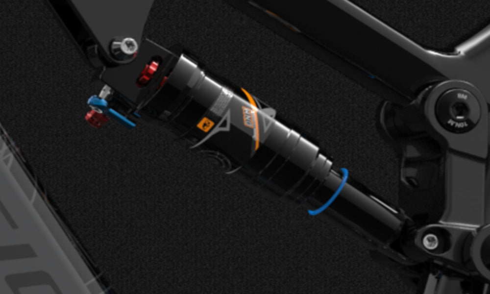 Close-up of a suspension system on a vehicle, with visible branding.