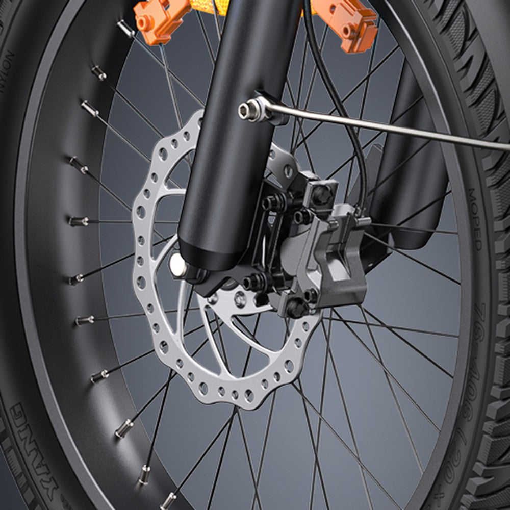 Close-up of a bicycle wheel with disc brake system on a gray background