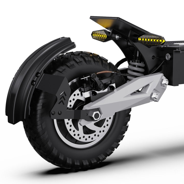 Close-up of a motorcycle wheel and suspension system on a white background
