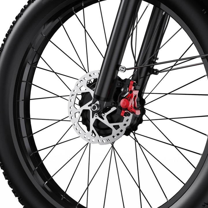 Close-up of a bicycle wheel with disc brake system on a white background