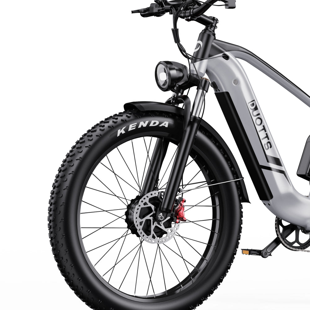 Electric bike with Kenda tires on a white background