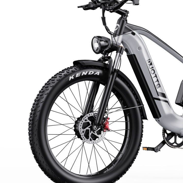 Electric bike with Kenda tires on a white background