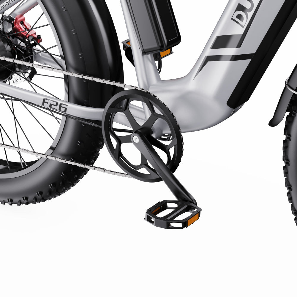 Close-up of a bicycle with a chain and pedal on a white background