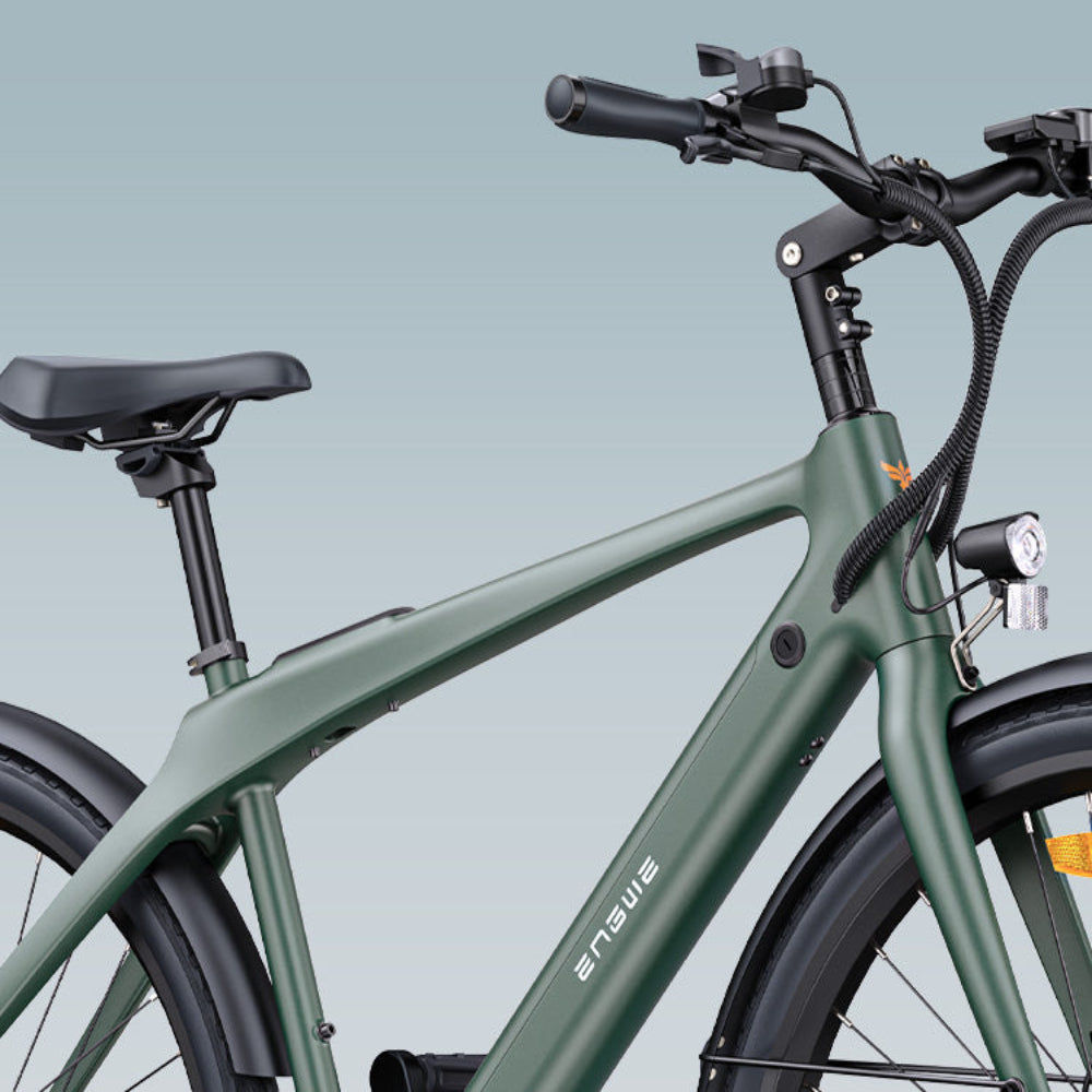 Green electric bicycle on a light blue background