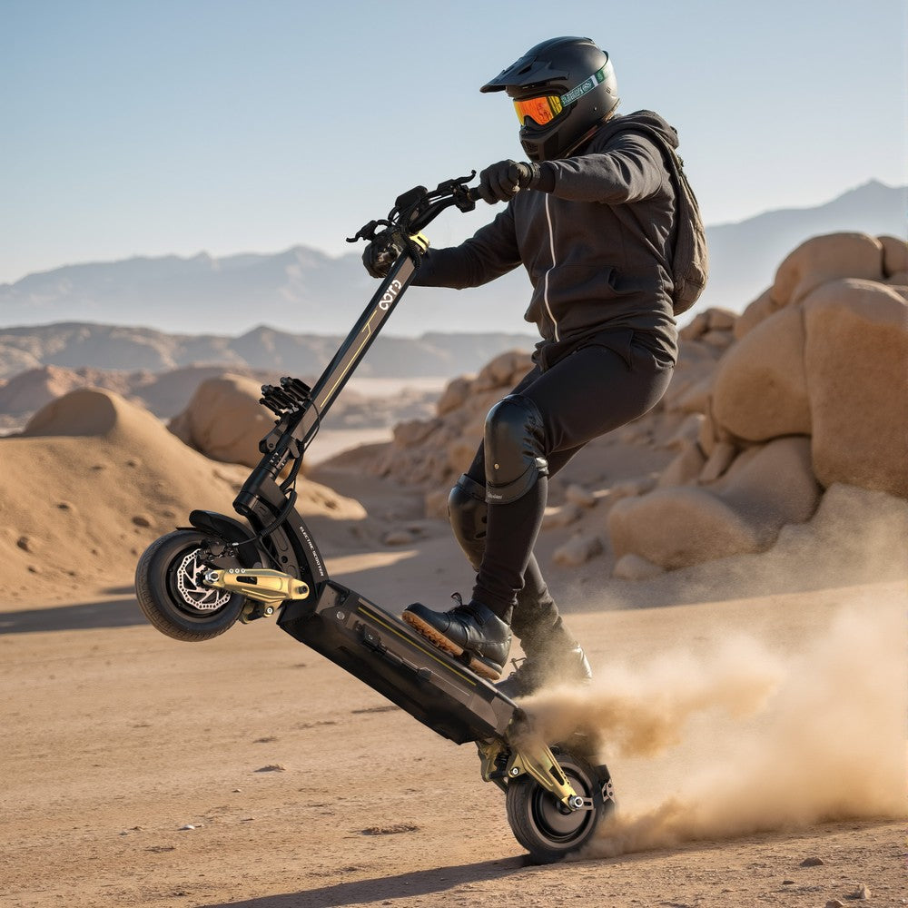 Person riding an electric scooter in a desert landscape with mountains in the background