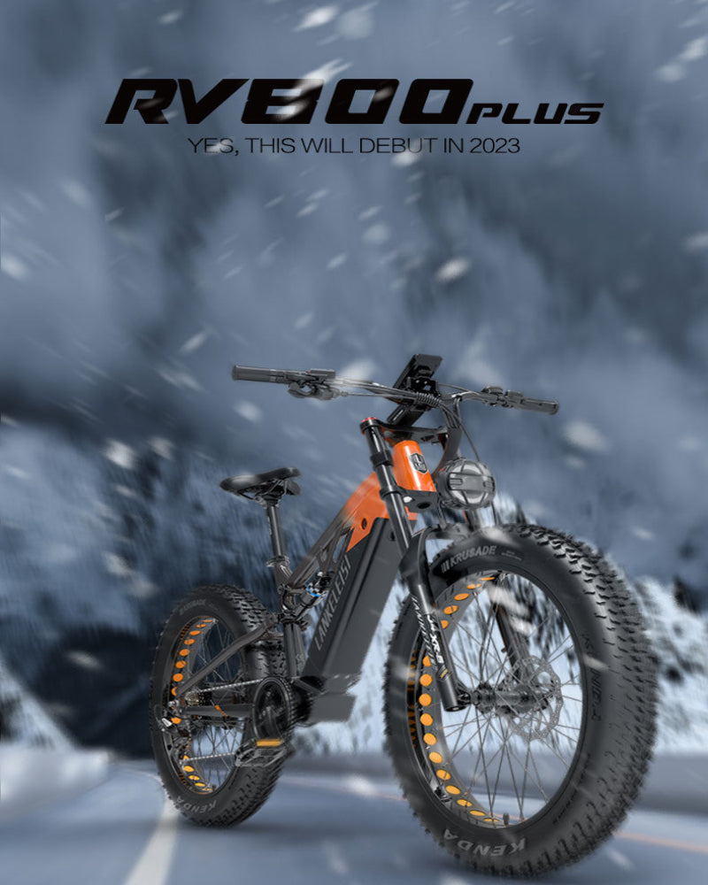 Electric bike with large tires on a snowy road, featuring the brand 'RV800 Plus'.