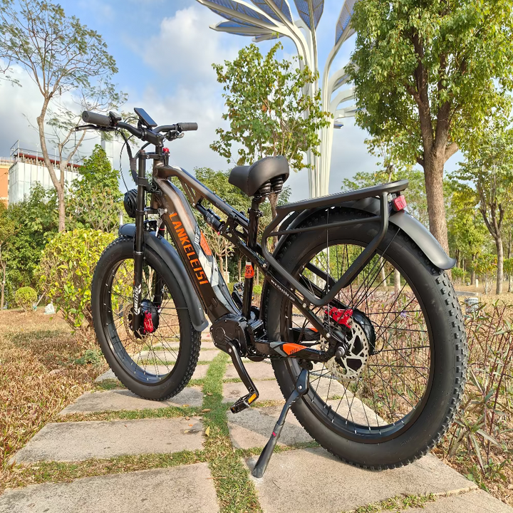 Electric bike on a stone path with trees and a building in the background